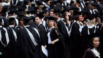 University graduates in caps and gowns at a graduation ceremony