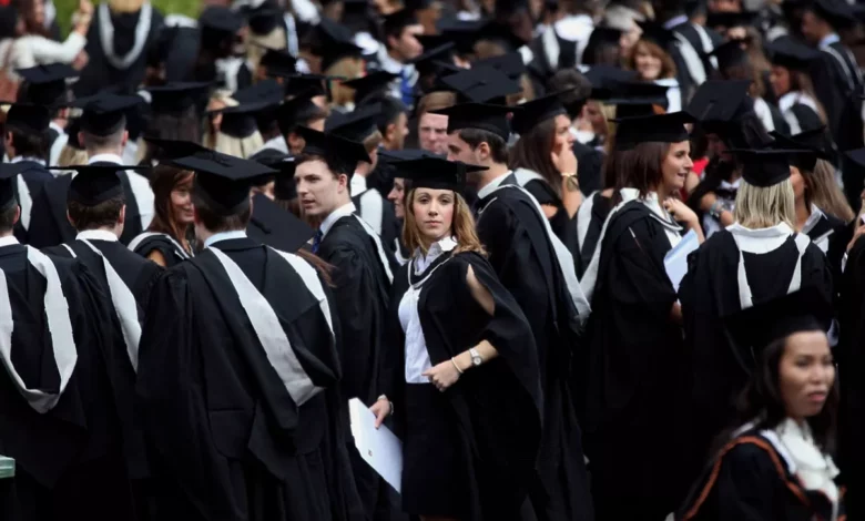 University graduates in caps and gowns at a graduation ceremony