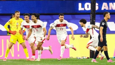 Football stadium in Los Angeles with players celebrating a stoppage-time goal