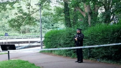 Police cordon tape stretched across a park entrance in Chelmsford during the murder investigation
