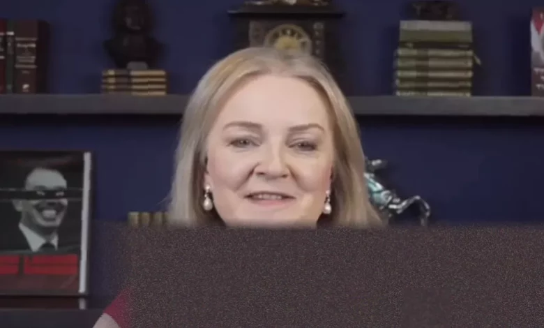 A small attic studio set with a webcam and microphone for a political YouTube channel