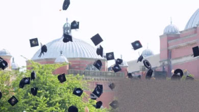 A graduate looks at a student loan statement showing increased debt balance