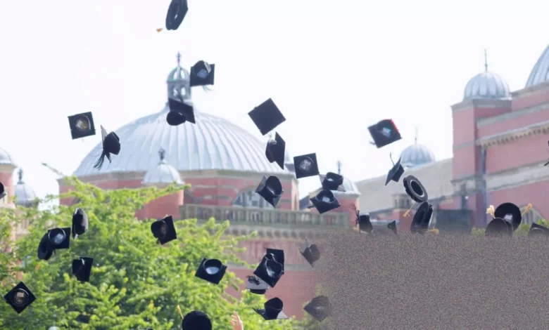 A graduate looks at a student loan statement showing increased debt balance