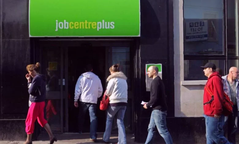 A closed job centre in a British town with a "No Vacancies" sign in the window