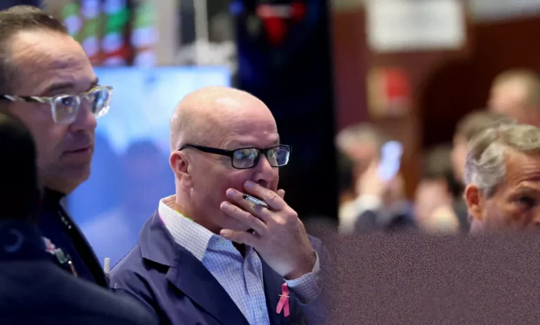 A screen on a trading floor showing a sharp drop on the Nasdaq Composite index.