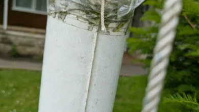 Damaged flagpole at Italian Gardens in Weston-super-Mare with rainbow flag lowered