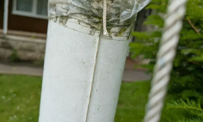 Damaged flagpole at Italian Gardens in Weston-super-Mare with rainbow flag lowered