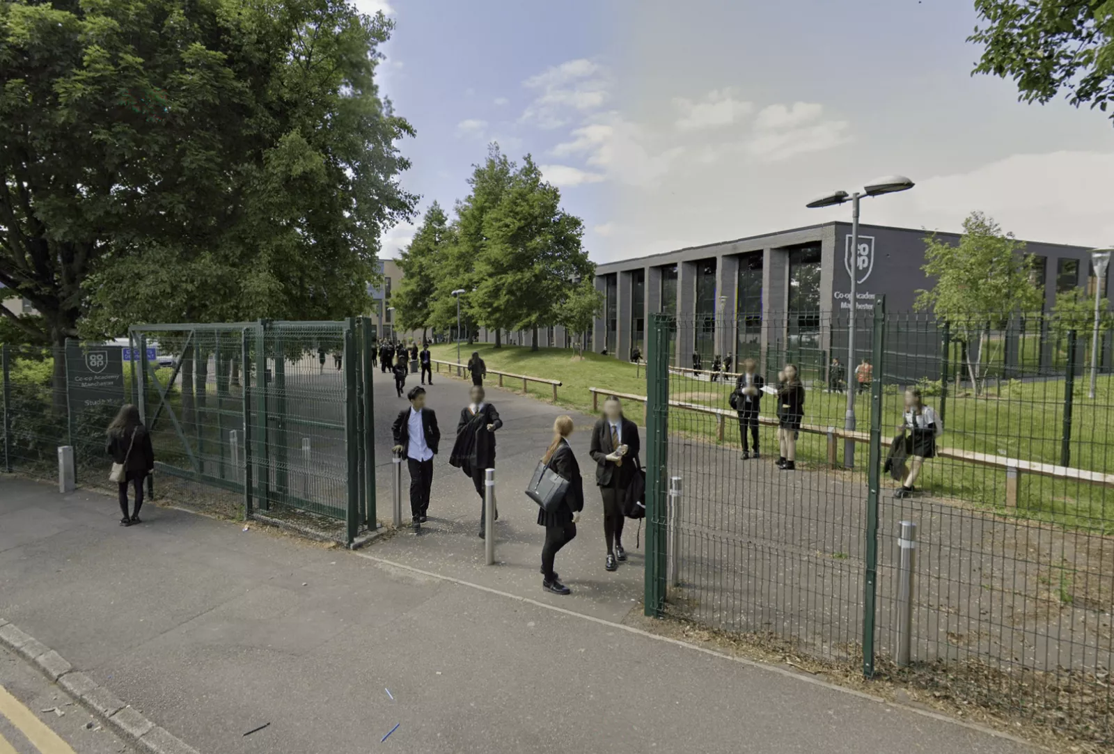 Students and staff evacuate a school building during a precautionary lockdown exercise.