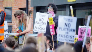 Protesters filling St Michael's Street in Oxford with banners and police cordons in place