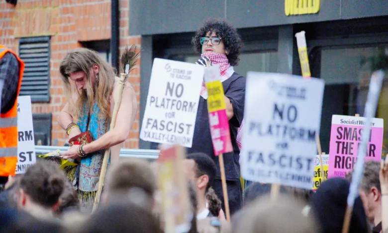 Protesters filling St Michael's Street in Oxford with banners and police cordons in place