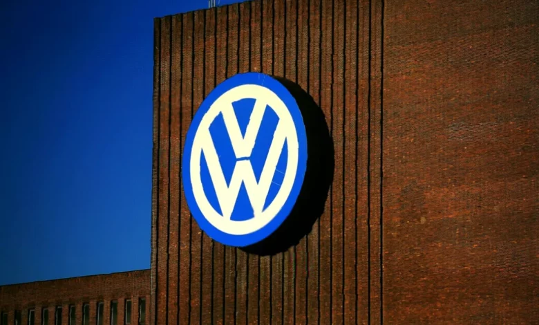 Rows of new Volkswagen cars parked at a German factory complex