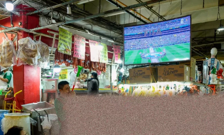 Lakeside table with television showing a World Cup match in France