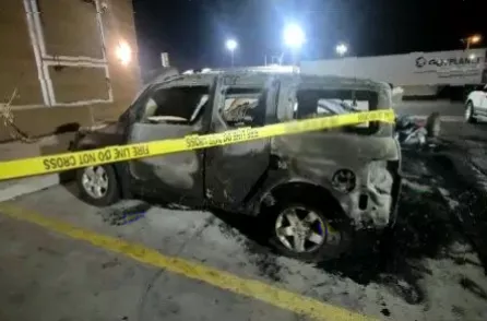 Emergency services and police vehicles at the scene of a car fire at a Hesperia truck stop.