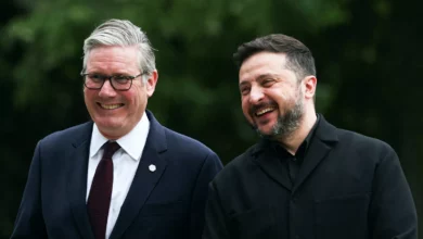 Ukrainian president and British prime minister embracing outside a government building