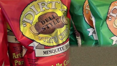 Bags of Zapp’s and Dirty brand potato crisps on a supermarket shelf in the United States