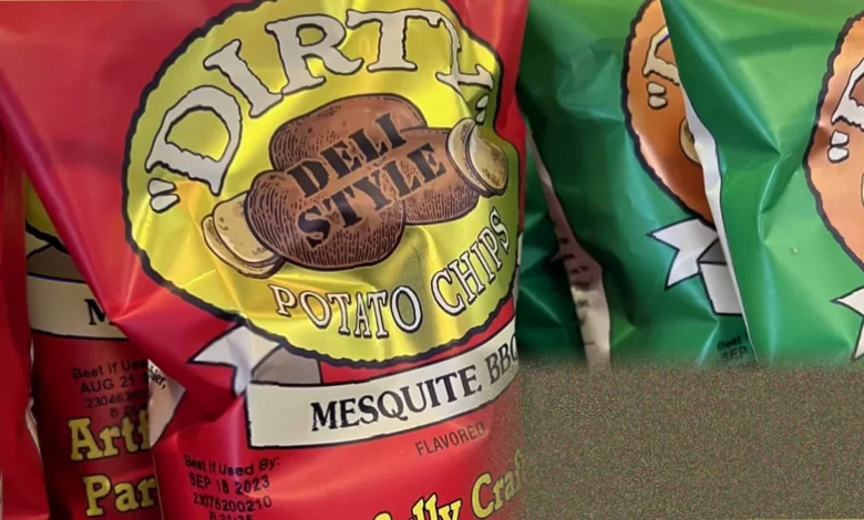 Bags of Zapp’s and Dirty brand potato crisps on a supermarket shelf in the United States
