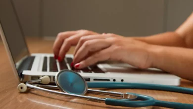 A clinician using a tablet with an AI documentation interface in a private practice treatment room