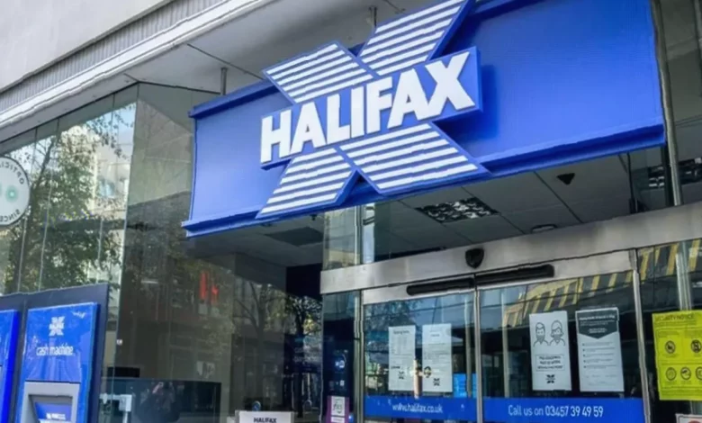 Halifax high street branch with signage being removed in a UK town centre
