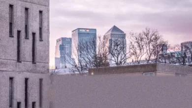 Crowded London street with residential buildings and commuters during rush hour