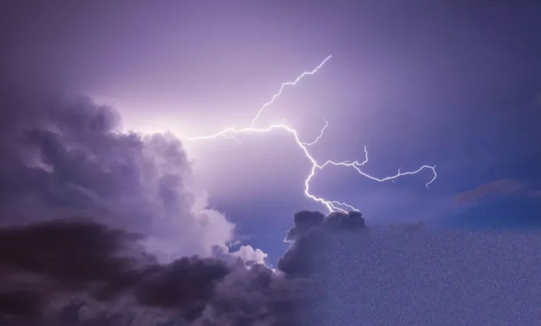 Lightning bolt striking over a summer field in the UK