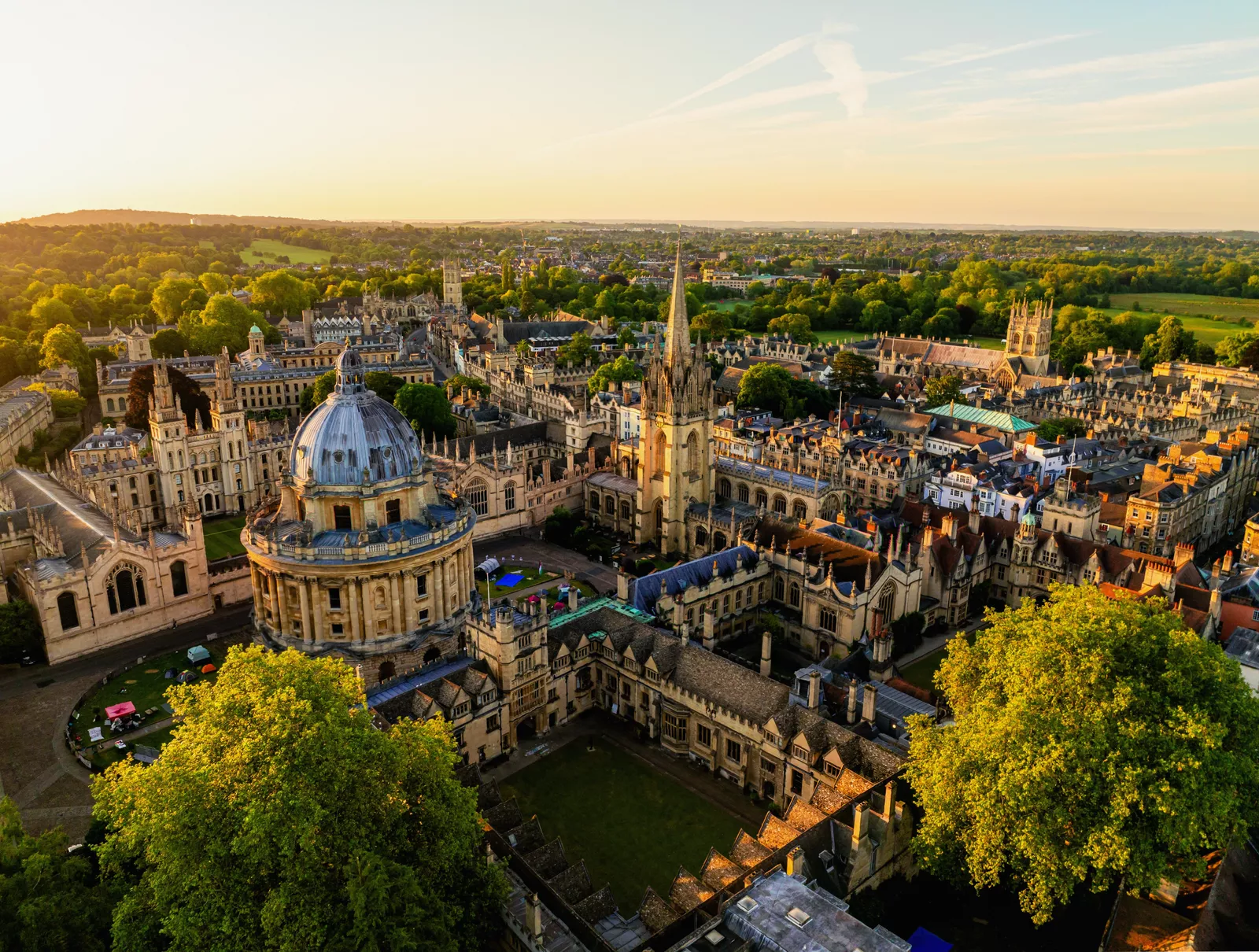 Cambridge University students walking between historic college buildings