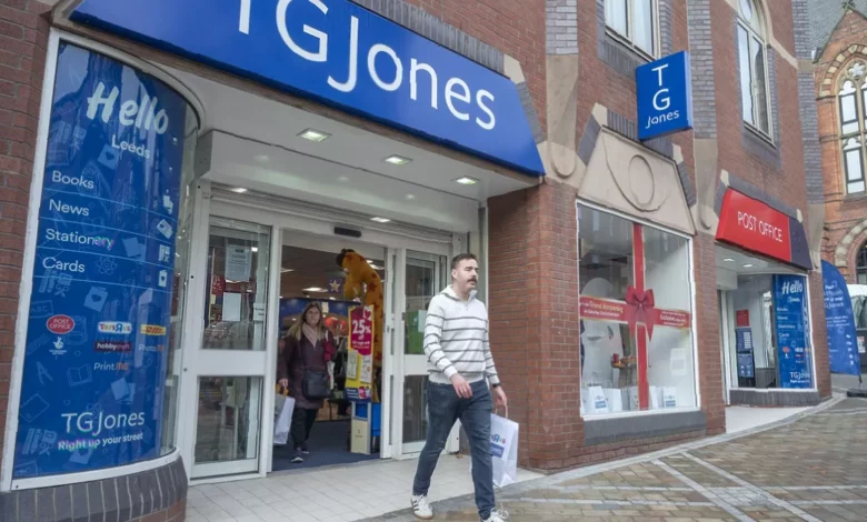 A closed TG Jones storefront with a sign reading "closed" in a British high street shopping area.